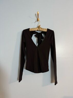 Free people black longsleeve with cut out and bow detail size XS
